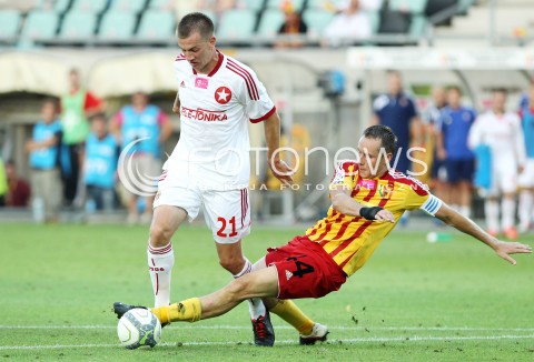  29.07.2013 KRAKOW <br />PILKA NOZNA POLSKA T-MOBILE EKSTRAKLASA SEZON 2013/2014 FOOTBALL POLISH EKSTRAKLASA SEASON 2013/2014 KORONA KIELCE - WISLA KRAKOW<br />N/Z LUKASZ BURLIGA PAWEL GOLANSKI KARNY FAUL <br /> 