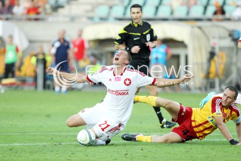  29.07.2013 KRAKOW <br />PILKA NOZNA POLSKA T-MOBILE EKSTRAKLASA SEZON 2013/2014 FOOTBALL POLISH EKSTRAKLASA SEASON 2013/2014 KORONA KIELCE - WISLA KRAKOW<br />N/Z LUKASZ BURLIGA PAWEL GOLANSKI KARNY FAUL <br /> 