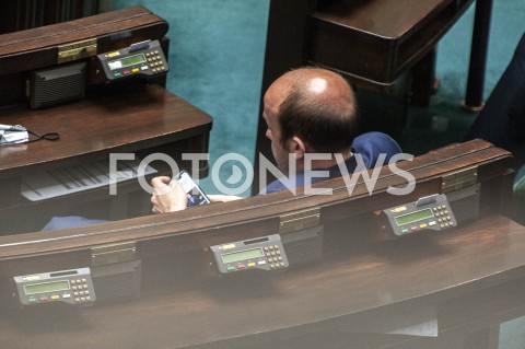  12.05.2020 WARSZAWA SEJM<br />
POSIEDZENIE SEJMU<br />
N/Z BORYS BUDKA OGLADAJACY SWOJE WYSTAPIENIE W TELEFONIE<br />
 
